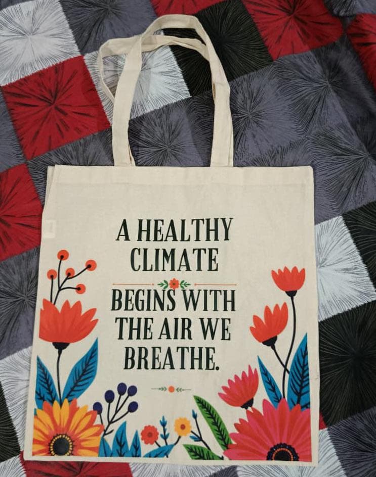 Natural tote with colourful flowers and a healthy climate message